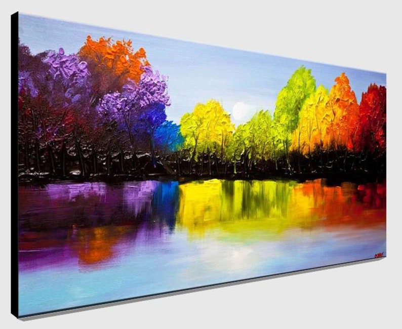 May include: A colorful abstract painting of a forest reflected in a still lake. The trees are painted in shades of purple, orange, yellow, green, and blue. The water is a light blue with reflections of the trees.