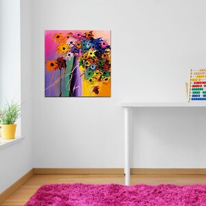 May include: Abstract painting of a colorful flower bouquet with yellow, orange, pink, purple, blue, and green hues. The painting is on a white wall in a room with a white desk and a wooden abacus.