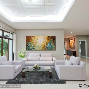 May include: A living room interior with white couches and a coffee table. A large abstract painting with blue, green, and yellow colors hangs on the wall.