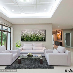 May include: A white, green, and gray abstract painting of flowers in a modern living room with white couches and a glass coffee table.