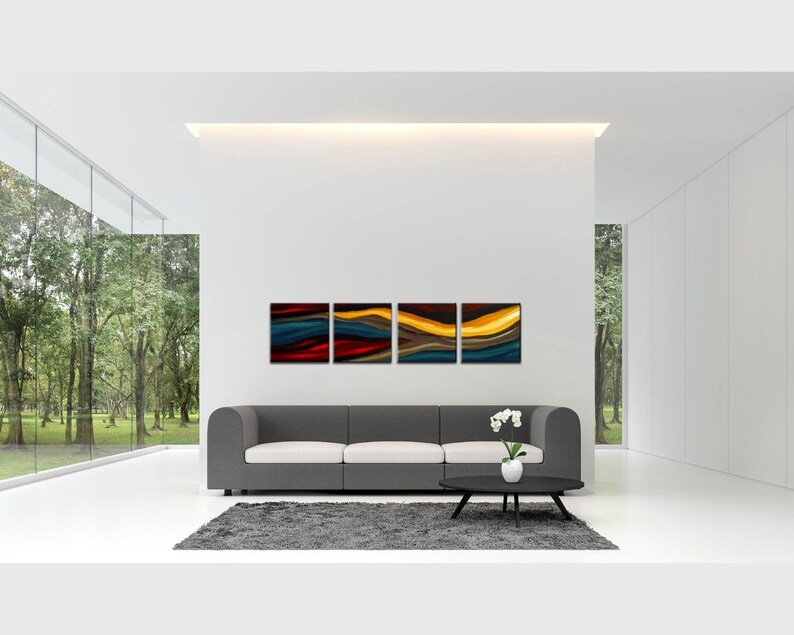 May include: A modern living room with a gray sofa and a coffee table. The wall behind the sofa has four abstract paintings with a blue, red, yellow, and gold color scheme.