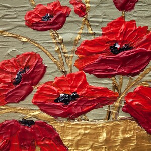 May include: A close-up of a painting of red poppies in a gold vase. The poppies are painted with thick, textured strokes of paint, giving them a three-dimensional appearance. The background is a light green color.