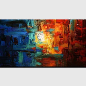 May include: Abstract painting with bold strokes of blue, red, orange, and yellow. The painting features a white circle in the center.