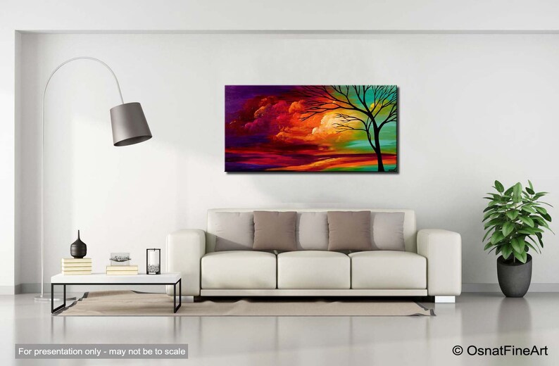 May include: Abstract painting of a colorful sunset with a silhouette of a tree in the foreground. The sky is a mix of purple, orange, red, and yellow. The tree is black against the bright sky.