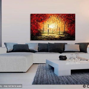 May include: Abstract painting of a forest scene with red, orange, and yellow trees. The painting is on a canvas and is framed. The painting is hanging on a wall in a living room.
