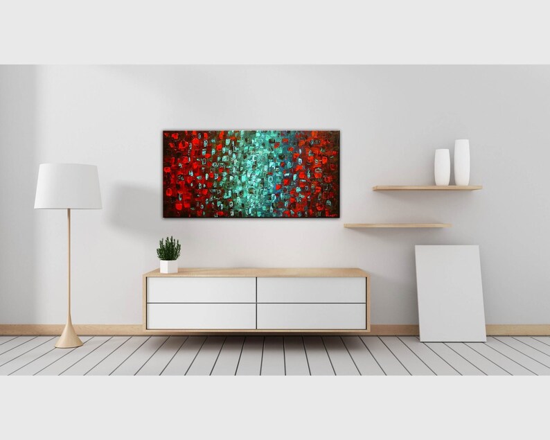 May include: Abstract painting with red, blue, and green squares on a canvas. The painting is hanging on a white wall above a white dresser with four drawers. There are two white vases on a wooden shelf above the dresser.