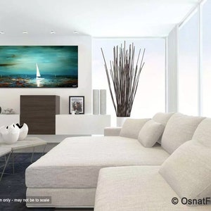 May include: Abstract painting of a sailboat on a teal blue ocean with a white sky. The painting is framed and hanging on a white wall in a living room setting.