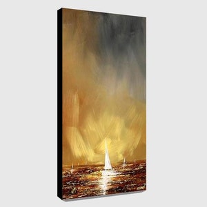 May include: An abstract painting of a seascape with sailboats. The artwork features a warm color palette of gold, brown, and gray, with a bright light reflecting on the water. The painting is on a black framed canvas.