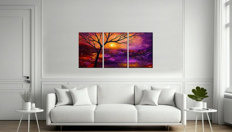 May include: A three-piece canvas print set featuring a silhouette of a tree with branches reaching towards a setting sun. The background is a vibrant mix of purple, orange, and yellow hues.