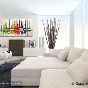 May include: Abstract painting of colorful sailboats on a white background, displayed in a modern living room with a white couch and a vase of brown branches.