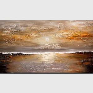 May include: Abstract painting of a sunset over a body of water. The sky is a mix of brown, orange, and white, with a hint of gold. The water is a dark blue, with a reflection of the sunset. The painting has a textured surface, giving it a three-dimensional look.