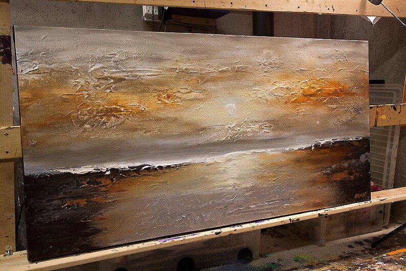 May include: Abstract painting on canvas with textured brushstrokes in shades of brown, white, and gray. The painting depicts a landscape with a horizon line and a sky with a white sun.