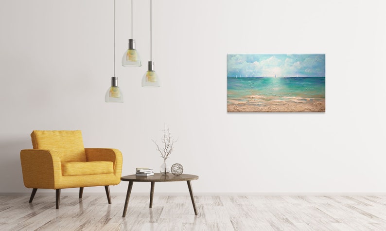 May include: A painting of a seascape with a blue sky, white clouds, and a turquoise ocean. The ocean is calm and the water is reflecting the sunlight. The beach is sandy and there are some footprints in the sand.