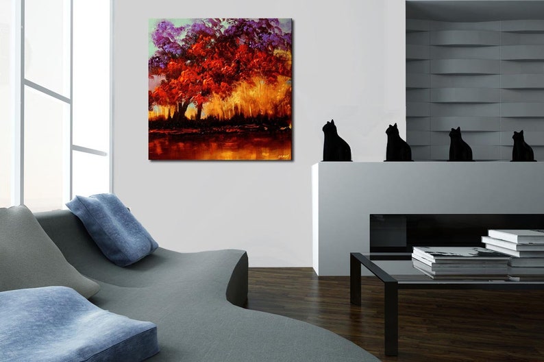 May include: A painting of a large red tree with purple leaves in a forest setting. The tree is in the center of the painting and is surrounded by other trees and bushes. The background is a soft, golden light.