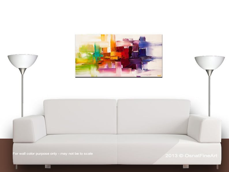 May include: Abstract painting with colorful geometric shapes in shades of yellow, orange, red, purple, blue, and green. The painting has a white background and is framed.