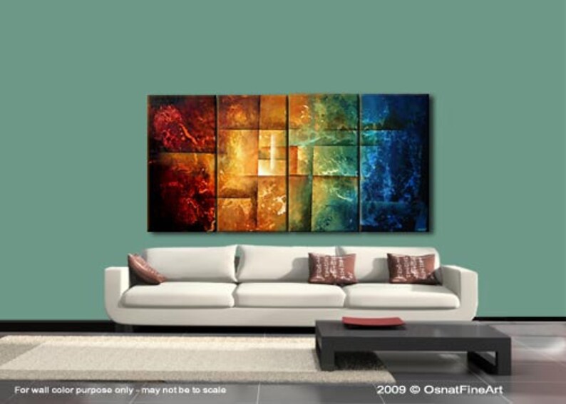 May include: Abstract painting with a geometric design in shades of red, orange, yellow, green, and blue. The painting is divided into squares and rectangles, creating a sense of depth and movement. The painting is displayed on a wall above a white sofa with pillows.