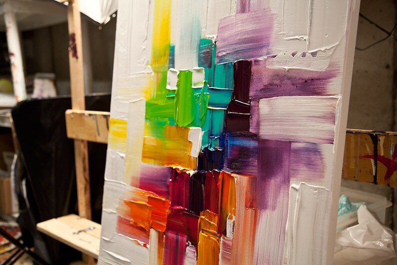 May include: Abstract painting on canvas with thick brushstrokes in shades of purple, green, yellow, orange, and red.