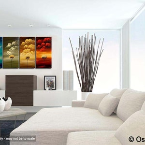 May include: A set of four abstract paintings depicting trees with colorful skies. The paintings are in a modern living room setting with a white couch and a vase of branches.