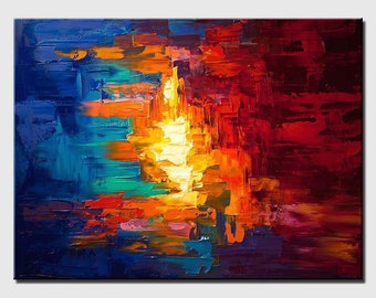 May include: Abstract painting with bold strokes of blue, red, orange, and yellow paint. The colors are vibrant and create a sense of energy and movement.