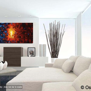 May include: Abstract painting with a vibrant orange and red color scheme, with a blue and black section on the left side. The painting is displayed on a white wall in a modern living room setting.
