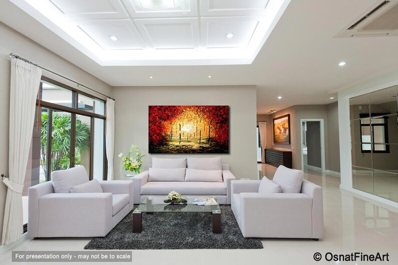 May include: A living room interior design with white couches and a coffee table. A large abstract painting of a forest scene in shades of red, orange, and yellow hangs on the wall.