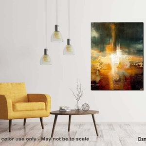 May include: Abstract painting with a white, yellow, orange, and brown colour scheme. The painting is on a canvas and is framed. The painting is hanging on a white wall in a living room setting.