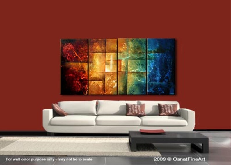 May include: Abstract painting with a geometric design in shades of red, orange, yellow, green, and blue. The painting is displayed on a wall above a white couch with brown throw pillows.