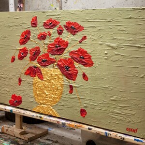 May include: A painting of a bouquet of red poppies in a gold vase on a textured green background. The artist's signature is visible in the lower right corner.