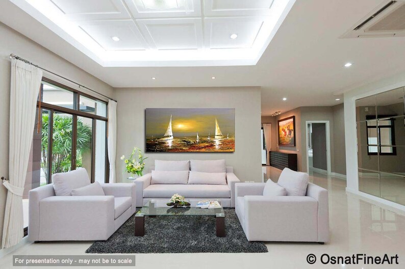May include: A living room interior with white couches and a coffee table. A large painting of sailboats at sunset hangs on the wall above the couch.