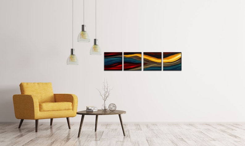 May include: A set of four abstract paintings with a modern design. The paintings feature a series of wavy lines in shades of red, yellow, blue, and brown. The paintings are hung on a white wall above a yellow armchair and a wooden coffee table.