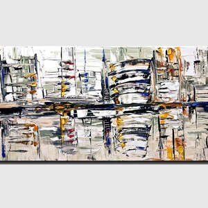 May include: Abstract painting of a cityscape with a mix of white, gray, blue, yellow, and red paint. The painting has a textured look and is reminiscent of a city skyline.
