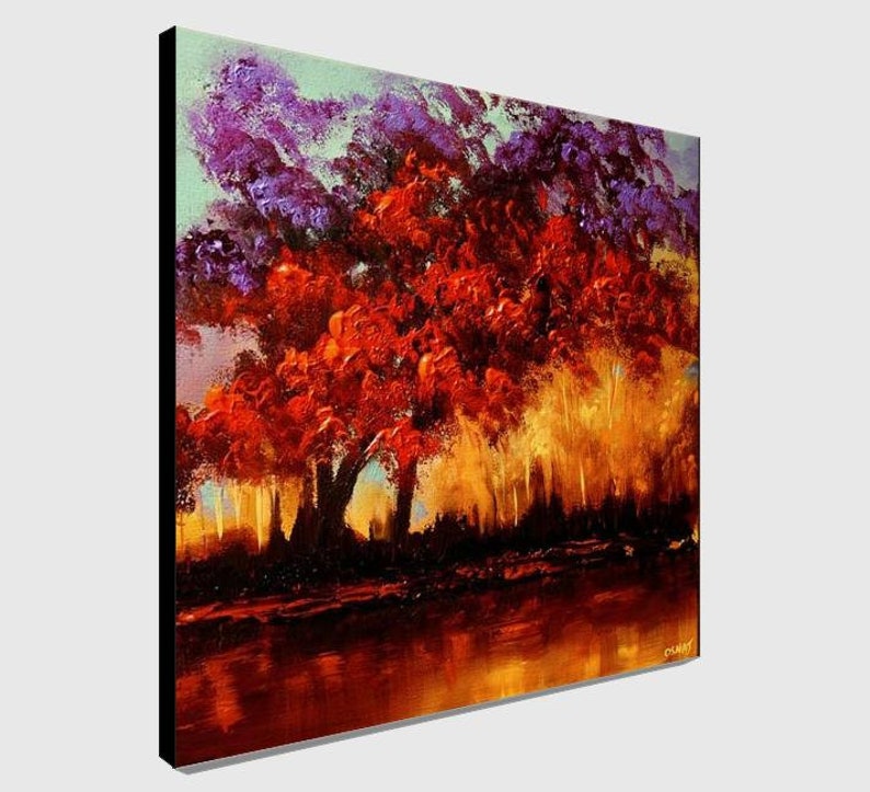 May include: A painting of a landscape with a large red tree in the foreground. The tree is surrounded by smaller trees and a body of water. The sky is a light blue color with purple clouds.