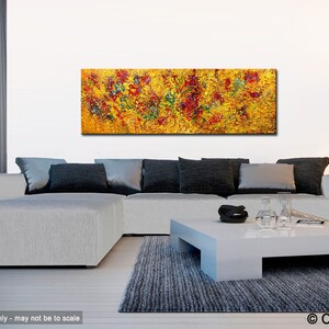May include: Abstract painting with a yellow background and red, green, and blue accents. The painting is displayed on a white wall above a gray sectional sofa and a white coffee table.