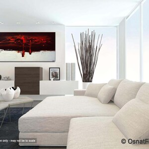 May include: Abstract painting in red, white, and black colors. The painting is hanging on a white wall in a modern living room with a white couch and a black and brown coffee table.