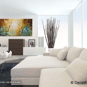 May include: A large abstract painting with a brown, yellow, and blue color scheme. The painting depicts a forest scene with trees and leaves. The painting is hanging on a white wall in a modern living room.