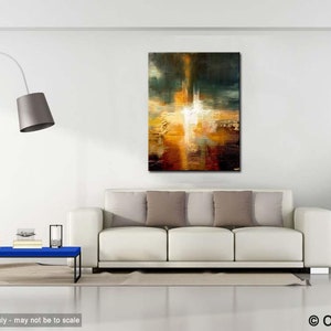 May include: Abstract painting with a white light in the centre, surrounded by shades of brown, orange, and yellow. The painting is hanging on a white wall above a white sofa with brown cushions.