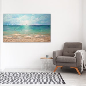 May include: A painting of a seascape with a sandy beach, turquoise water, and a bright blue sky with white clouds.  Sailboats are visible in the distance.