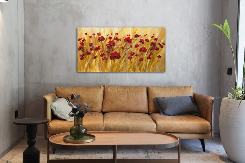 May include: A painting of a field of red poppies against a golden background. The painting is done in a textured style, giving the impression of brushstrokes.