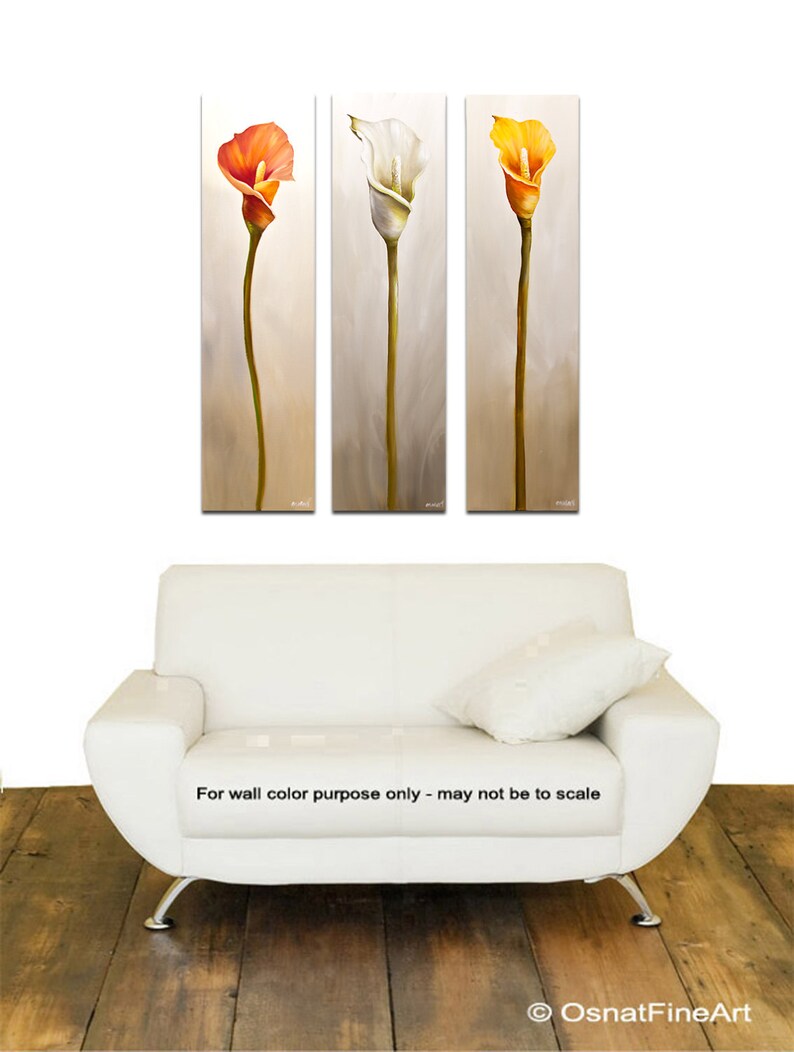 May include: Three vertical paintings of stylized Calla Lilies. The first painting features an orange flower, the second a white flower, and the third a yellow flower. The background of each painting is a light gray.