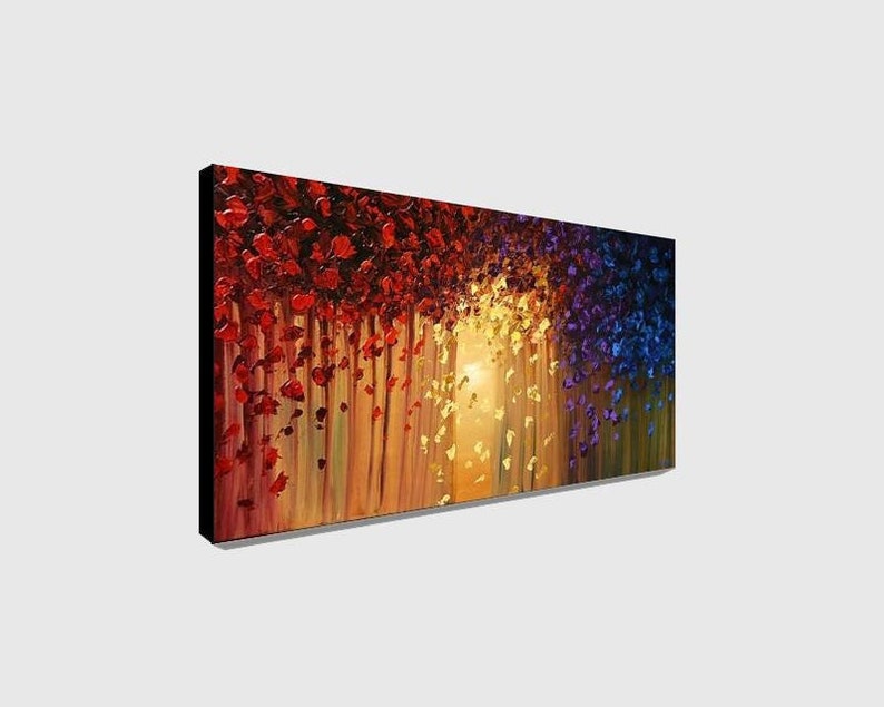 May include: Abstract painting with a colorful, textured design. The painting features a cascade of red, yellow, and blue brushstrokes, creating a sense of movement and depth. The background is a warm, golden hue, adding a sense of warmth and light to the piece.