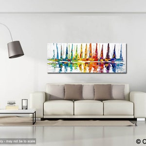 May include: Abstract painting of colorful sailboats on a body of water with reflections. The painting is in a modern living room setting with a white couch and a floor lamp.