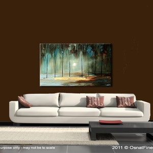 May include: Abstract painting of a forest scene with trees and a sunlit clearing. The painting is done in shades of blue, green, and brown. The painting is displayed on a wall above a white sofa with pillows.