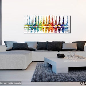 May include: Abstract painting of colorful sailboats on a white background with reflections in the water. The painting is displayed on a wall in a living room setting.