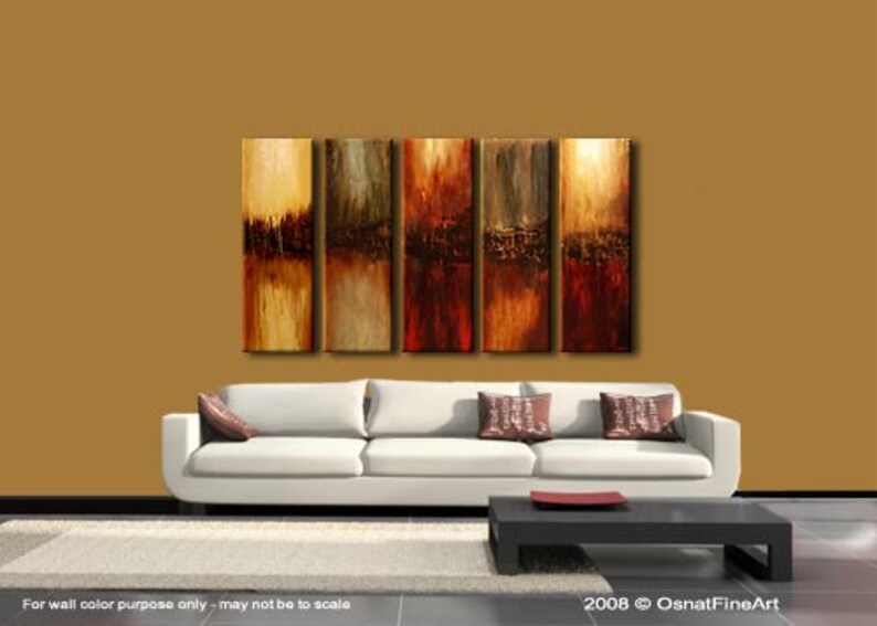 May include: Abstract art painting in shades of brown, red, and gold. The painting is divided into five vertical panels, each with a different abstract design. The painting is displayed on a wall above a white couch.