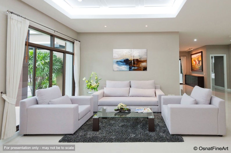May include: A living room interior design with a white sofa, two armchairs, a glass coffee table, and a large abstract painting on the wall. The room has a gray rug, white curtains, and large windows.