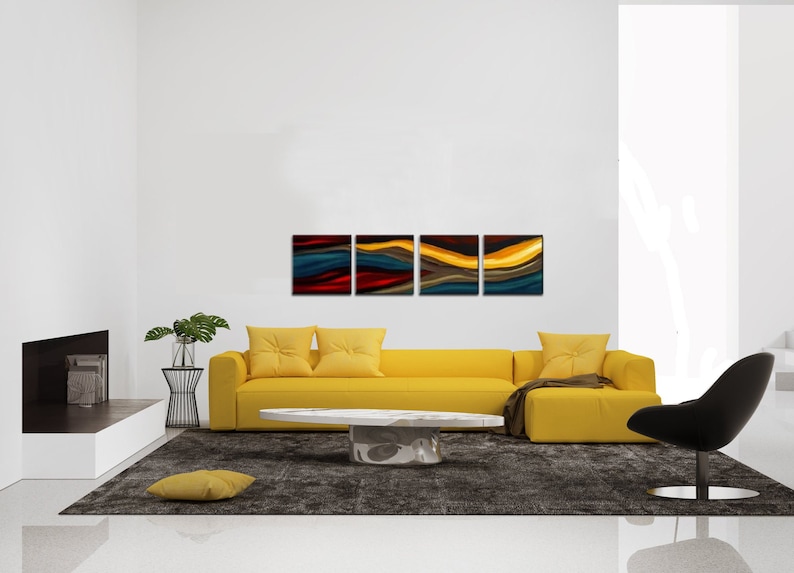 May include: A set of four abstract art prints with a modern design. The prints feature a series of colorful, wavy lines in shades of blue, red, yellow, and brown. The prints are arranged in a row on a white wall above a yellow sofa.