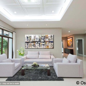 May include: Abstract painting in shades of white, gray, and black with hints of yellow and blue. The painting is hanging on a wall in a living room with white couches and a glass coffee table.