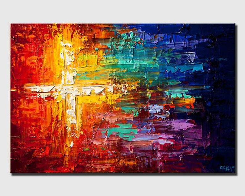 May include: Abstract painting with a white cross shape in the center. The background is a mix of red, orange, yellow, green, blue, and purple.