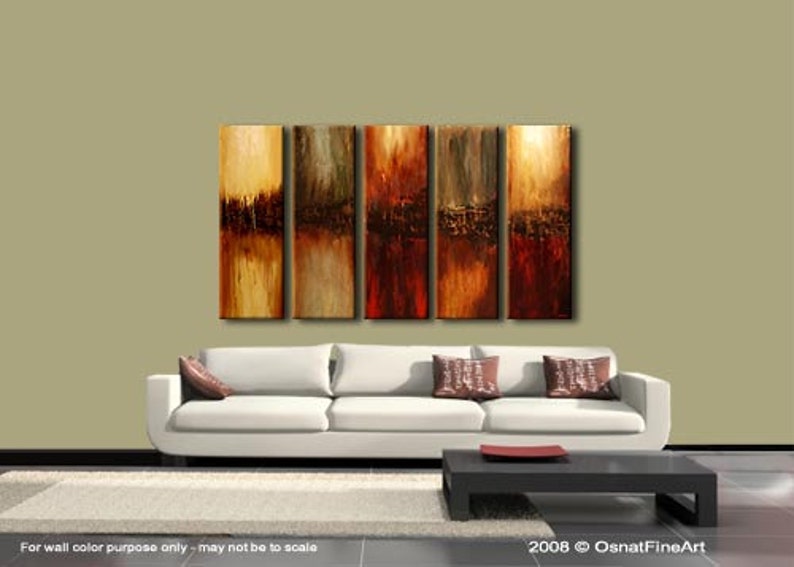 May include: Abstract art painting in shades of brown, orange, and red. The painting is divided into five vertical panels, each with a different abstract design. The painting is displayed on a wall above a white sofa.