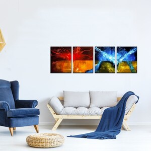 May include: A set of three abstract art prints featuring a mix of red, orange, yellow, blue and green colors. The prints are framed in black and arranged in a row on a white wall.